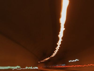 Blurred light lines showing dynamic movement path.