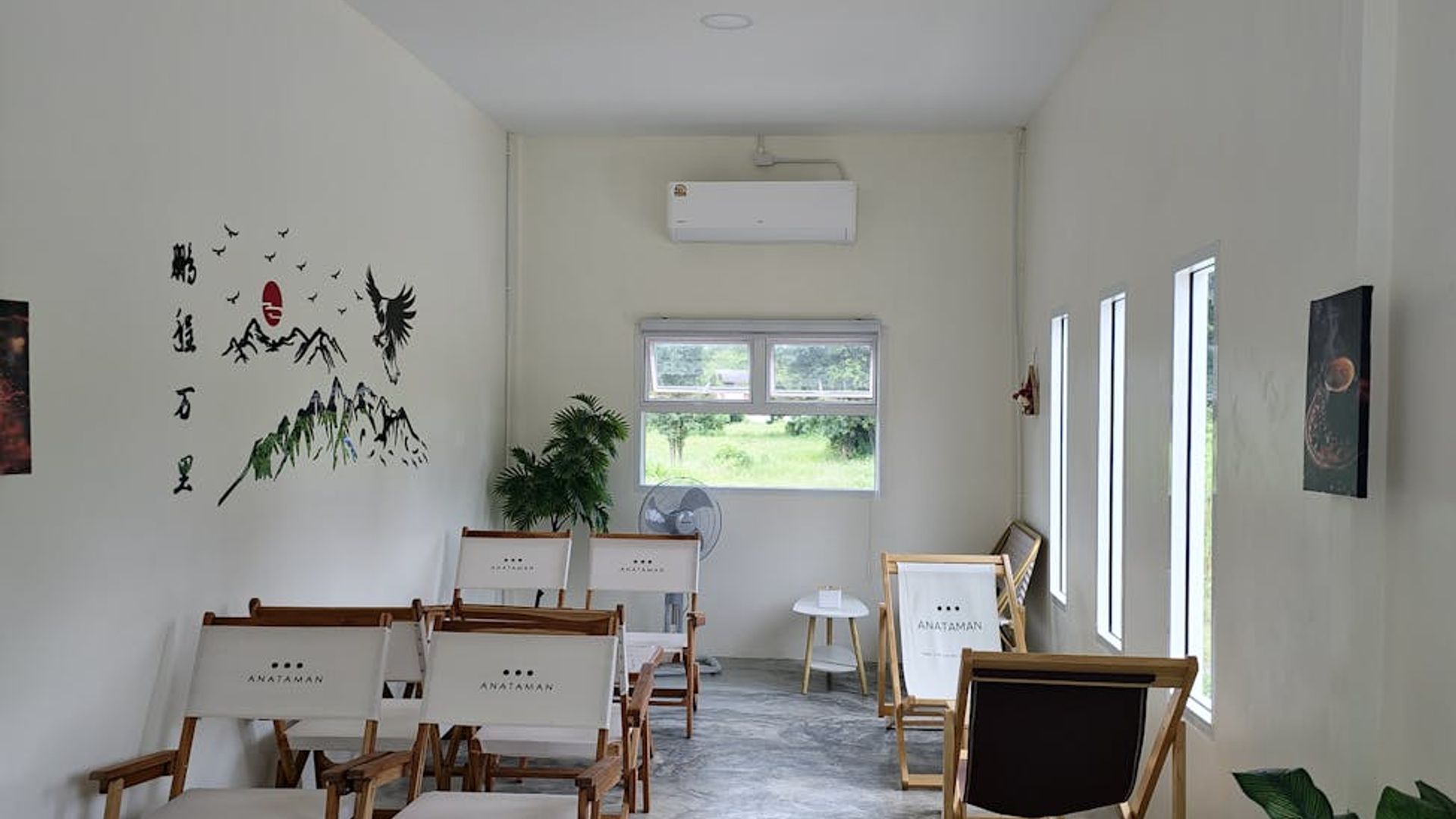 Dark minimalist room with soft light hitting the wall surface.